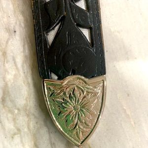 Lady’s Cowboy Belt. Unnoticeable tear by buckle. See last photo